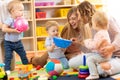 Group of moms with their babies in nursery Royalty Free Stock Photo