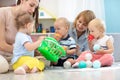 Group of moms with their babies in nursery. Socialization and adaptation kids for kindergarten Royalty Free Stock Photo