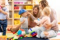 Group of moms with their babies at playgroup