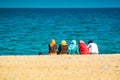 Group of Moroccan women sitting on the beach