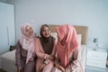 Group of moslem woman sitting on the bed enjoy chatting together