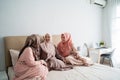 Group of moslem woman sitting on the bed enjoy chatting together