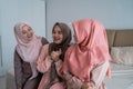 Group of moslem woman sitting on the bed enjoy chatting together