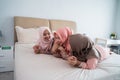 Group of moslem woman lying on the bed enjoy chatting together