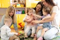 Group of mothers with babies at playgroup Royalty Free Stock Photo