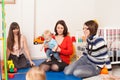 Group of mothers with their babies Royalty Free Stock Photo