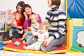 Group of mothers with their babies Royalty Free Stock Photo