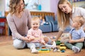 Group of mothers with their babies Royalty Free Stock Photo