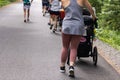 Group of mothers walking outside with their babies Royalty Free Stock Photo