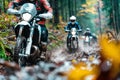 Group of motorcyclists riding through a forest trail Royalty Free Stock Photo