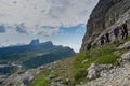 Group of mountain climbers hiking up a mountain side to a hard climbing route