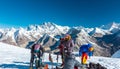 Group of Mountain Climbers preparing for ascent on high Peak Royalty Free Stock Photo