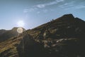 Group of mountaineers climbing the mountain at sunrise in Lofoten, Norway Royalty Free Stock Photo