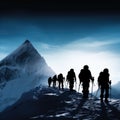 A group of mountaineers climbs to the top of a snow-capped mountain Royalty Free Stock Photo