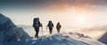 A group of mountaineers climbs to the top of a snow-capped mountain Royalty Free Stock Photo