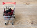 Group of mulberries in red shopping cart on wooden table. Mulberry this a fruit and can be eaten in have a red and purple color. M Royalty Free Stock Photo