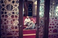 Group of muliethnic religious muslim young people praying and reading Koran together. Group of muslims praying in the mosque