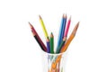 group of Multi-colored pencils in a transparent glass mug isolated on white Royalty Free Stock Photo