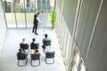 Group of multi-ethnic business people having board meeting in modern office businessman in casual making presentation to office Royalty Free Stock Photo