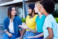 Group of multi ethnic female young adults talking about problems Royalty Free Stock Photo