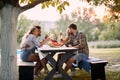 Group of multi-ethnic friends having fun outdoor, talking and laughing