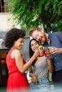 Group of diverse friends talking and having fun at cafe outdoor Royalty Free Stock Photo