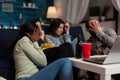 Group of multi-ethnic friends watching horror thriller movie on laptop computer Royalty Free Stock Photo