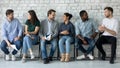 Group of multi ethnic people talking gathered in office corridor Royalty Free Stock Photo