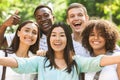 Group of multi-ethnic teen friends taking selfie picture outdoors