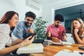 Group of young students preparing for exams in home interior Royalty Free Stock Photo