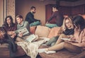 Group of multi ethnic young students preparing for exams in home interior Royalty Free Stock Photo