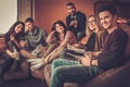 Group of multi ethnic young students preparing for exams in home interior Royalty Free Stock Photo