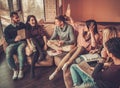 Group of multi ethnic young students preparing for exams in home interior Royalty Free Stock Photo