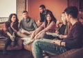 Group of multi ethnic young students preparing for exams in home interior Royalty Free Stock Photo