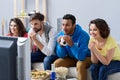 Group of multi national football fans cheering Royalty Free Stock Photo