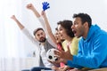 Group of multi national football fans cheering Royalty Free Stock Photo