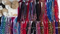 Group of multicolored bracelets made by hand by indigenous Ecuadorians for sale in a craft market