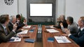 Business meeting. Group of multicultural business people having video conference while sitting in the meeting room Royalty Free Stock Photo