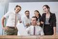 Group of multicultural employees talking and having fun in the business meeting