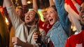 Group of Multicultural Friends Watching a Live Soccer Match in a Sports Bar. Focus on Beautiful