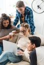 group of multicultural teens looking at laptop Royalty Free Stock Photo