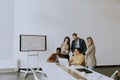 Group of multiethnic business people working together and preparing new project on a meeting in office Royalty Free Stock Photo