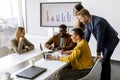 Group of multiethnic business people working together and preparing new project on a meeting in office Royalty Free Stock Photo