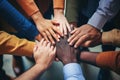Group of multiethnic businesspeople joining hands together in a circle, A group of diverse hands holding each other in support, Royalty Free Stock Photo