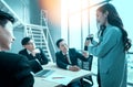 Group of multiethnic busy people working in an office, Aerial view with businessman and businesswoman sitting around a Royalty Free Stock Photo