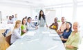 Group of Multiethnic Cheerful Corporate People Having a Meeting Royalty Free Stock Photo