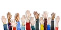 Group of Multiethnic Diverse Hands Raised Royalty Free Stock Photo