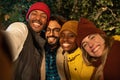 Group of multiethnic friends taking selfie on country hike Happy trekkers on excursion in the nature Royalty Free Stock Photo
