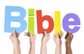 Group of Multiethnic Hands Holding Bible Royalty Free Stock Photo