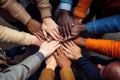 Group of multiethnic people putting their hands on top of each other, Closeup of diverse people joining their hands, top view, AI Royalty Free Stock Photo